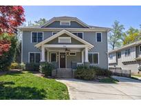 Charming two-story home with covered porch, manicured lawn, and inviting curb appeal at 358 Southerland Ne Ter, Atlanta, GA 30307