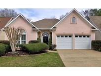 Charming single-story home featuring a well-manicured lawn, a two-car garage, and a welcoming entrance at 4103 Christacy Way, Marietta, GA 30066