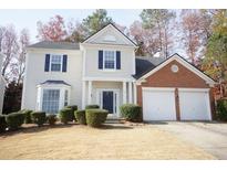 Charming two-story home with a two-car garage, well-maintained landscaping, and a welcoming front entrance at 3936 Toccoa Falls Dr, Duluth, GA 30097