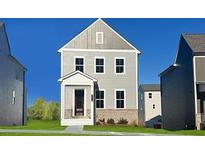Charming two-story home with neutral siding, a covered entry, and well-manicured lawn at 2705 Creek View Nw Ter, Atlanta, GA 30318