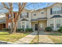 Inviting two-story home with a well-maintained front yard and charming curb appeal at 127 Hawkeye Ln, Conyers, GA 30012