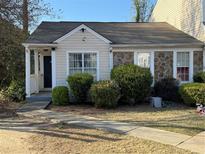 Charming single-Gathering home with a stone facade and well-maintained front yard at 3987 Bayside Cir, Atlanta, GA 30340