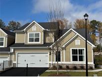 New two-story home featuring an attached two-car garage, manicured lawn, and craftsman-style details at 1601 Bonica Xing # 1601, Cumming, GA 30040