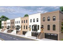 Charming row of townhouses featuring brick facades, black framed windows, and convenient garage access at 345 Sugarview Rd, Sugar Hill, GA 30518