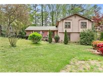 Charming two-story home with landscaped front yard and mature trees at 2720 Cold Springs Sw Trl, Marietta, GA 30064