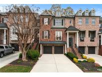 Beautiful brick townhome with a two-car garage and well-maintained landscaping at 1453 Montclair Se Ct # 26, Smyrna, GA 30080