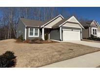 Charming single-story home featuring a welcoming facade and well-maintained landscaping at 63 Aspen Way, Dallas, GA 30157