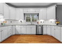 Bright kitchen featuring white cabinets, stainless steel appliances, and granite countertops at 5729 Brookstone Nw Walk, Acworth, GA 30101