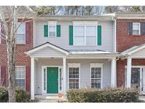 Charming townhouse with a green front door and complimentary shutters at 20 Pine Canyon Sw Dr # 26, Atlanta, GA 30331