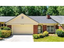 Charming single-story home featuring a brick facade, attached garage, and well-maintained landscaping at 6190 Douglas Manor Ct, Douglasville, GA 30134