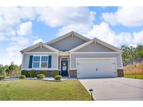 Charming single-Gathering home featuring a two-car garage, and a well-manicured front yard at 6920 Oak Valley Dr, Douglasville, GA 30134