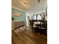 Living room features wood floors and dining table at 400 17Th Nw St # 2031, Atlanta, GA 30363