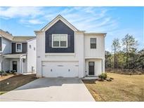 Charming two-story home boasts a crisp white exterior and a well-manicured lawn at 2789 Aralynn Way, College Park, GA 30337