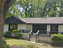 Charming single story home with landscaped front yard and inviting front porch at 1956 Shirley Sw St, Atlanta, GA 30311