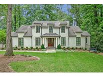 Beautiful two-story home featuring a manicured lawn and a classic architectural design at 3776 N Stratford Ne Rd, Atlanta, GA 30342
