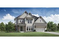 Beautiful two-story home with a manicured lawn, detailed trim and a two car garage at 6470 Pond View Dr, Cumming, GA 30028