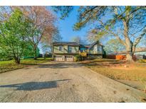 Charming two-story home with a spacious driveway and attached two-car garage at 895 Tyrell Dr, Austell, GA 30106
