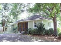 Charming single-story home with a screened-in porch and beautiful landscaping at 1908 Bouldercrest Se Rd, Atlanta, GA 30316