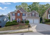 Charming two-story home featuring a brick facade and a two-car garage at 4005 Saddlebrook Creek Dr, Marietta, GA 30060