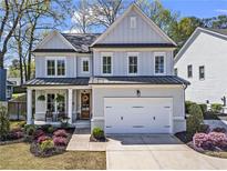 Beautiful two-story home featuring a two-car garage and well-manicured landscaping at 1291 Briarwood Ne Rd, Brookhaven, GA 30319