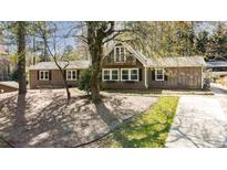 Charming two-story home featuring a balcony and beautiful landscaping at 53 Weatherstone Pkwy, Marietta, GA 30068