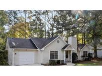 Charming single-story home featuring a well-manicured front yard and attached garage at 164 Adrian Dr, Stockbridge, GA 30281