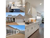 This spacious kitchen features modern appliances, white cabinetry, and a large center island with seating at 518 Newstead Way, Woodstock, GA 30188