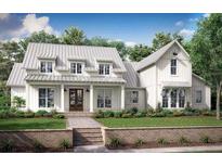 Charming two-story home with white siding and well-manicured lawn at 0 Mcbride Rd, Fayetteville, GA 30215