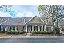 Charming home featuring a well-manicured yard with beautiful stone landscaping and classic architectural details at 625 Aunt Lucy Ln # 45, Smyrna, GA 30082