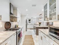 Bright updated kitchen with stainless appliances, marble countertops, and a spacious island at 3965 Hamilton View Way, Dacula, GA 30019