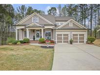 Charming home with a well-maintained front yard, two-car garage, and inviting entrance at 55 Hazelbrook Way, Acworth, GA 30101
