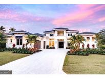 A luxury home with a white facade, manicured landscaping, and a circular driveway at 0 Ebenezer Rd, Fayetteville, GA 30215