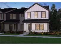 Charming two-story home with a covered porch, well-manicured lawn and eye-catching black and white color scheme at 2264 Ashton Dr, Conyers, GA 30013