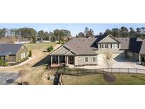 Charming single-Gathering home with an inviting front yard and a welcoming screened-in porch at 57 Cedarcrest Village Ln, Acworth, GA 30101