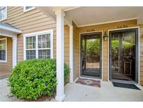 Inviting front entrance to a two-unit townhome, numbers 5636 and 5638 at 5638 River Heights Se Xing, Marietta, GA 30067