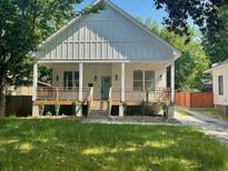 Charming craftsman-style home with a welcoming front porch and well-manicured lawn at 851 Dill Sw Ave, Atlanta, GA 30310