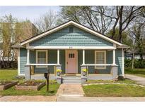 Charming bungalow featuring a covered front porch, craftsman details, and a well-maintained lawn at 891 Spencer Nw St, Atlanta, GA 30314