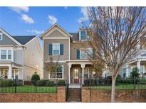 Charming two-story home featuring a well-manicured lawn and a brick and wrought iron fence at 2172 Haventree Ct, Lawrenceville, GA 30043