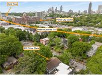 Expansive aerial view showcasing 811 Ponce Place, the Beltline Trail, Ponce City Market, and O4W Park at 811 Ponce De Leon Ne Pl, Atlanta, GA 30306