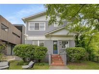 Charming two-story home with a well-maintained gray exterior, classic architecture, and a welcoming front entrance at 811 Ponce De Leon Ne Pl, Atlanta, GA 30306