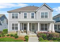 Charming two-story home with a covered front porch, perfect for enjoying the outdoors at 9893 Colchester St, Douglasville, GA 30135