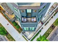 Modern home with a unique design, featuring a cozy balcony with outdoor seating and beautiful landscaping at 8 Bass Se St, Atlanta, GA 30315