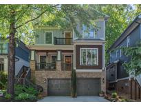 Charming home boasting a brick foundation, grey painted upper stories, and a welcoming two-car garage at 3253 Cates Ave, Brookhaven, GA 30319