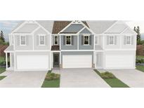 Two-story townhome with a two-car garage and blue siding at 6343 Towhee Way, Morrow, GA 30260