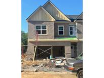 New construction two-story townhome featuring a brick facade and two-car garage at 3108 Marbella Cir # 4, Kennesaw, GA 30152