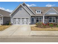 Charming home with a two-car garage, stone accents, and a well-maintained front yard at 510 Riverview Ln, Canton, GA 30114