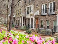 Charming brick townhomes showcase landscaped grounds and private entries, offering inviting curb appeal at 2168 Rock Creek Park, Decatur, GA 30033