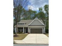 Charming single-Gathering home with a manicured lawn and a two-car garage at 3455 Buffington Ln, Cumming, GA 30040