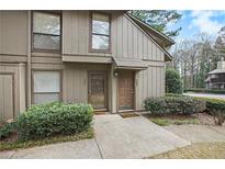 Inviting townhome exterior featuring a well-maintained facade and landscaped front entrance with twin entry doors at 508 Cumberland Se Ct, Smyrna, GA 30080