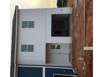 New construction two-story home showing the side entrance and garage at 1326 Riverstone Rd, Jonesboro, GA 30238